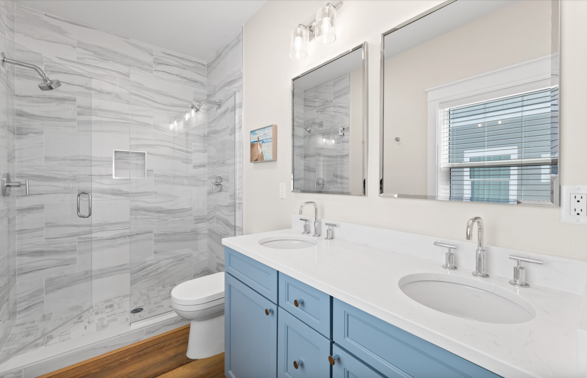 Step into your spa-like sanctuary with dual sinks, a spacious walk-in shower, and elegant marble finishes that create the perfect retreat.