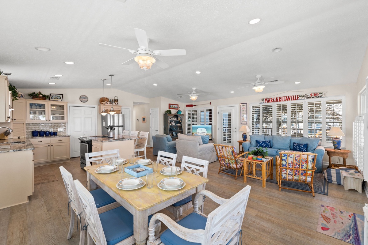 Your spacious open-concept living area blends kitchen, dining, and lounge seamlessly with coastal charm and modern comfort.