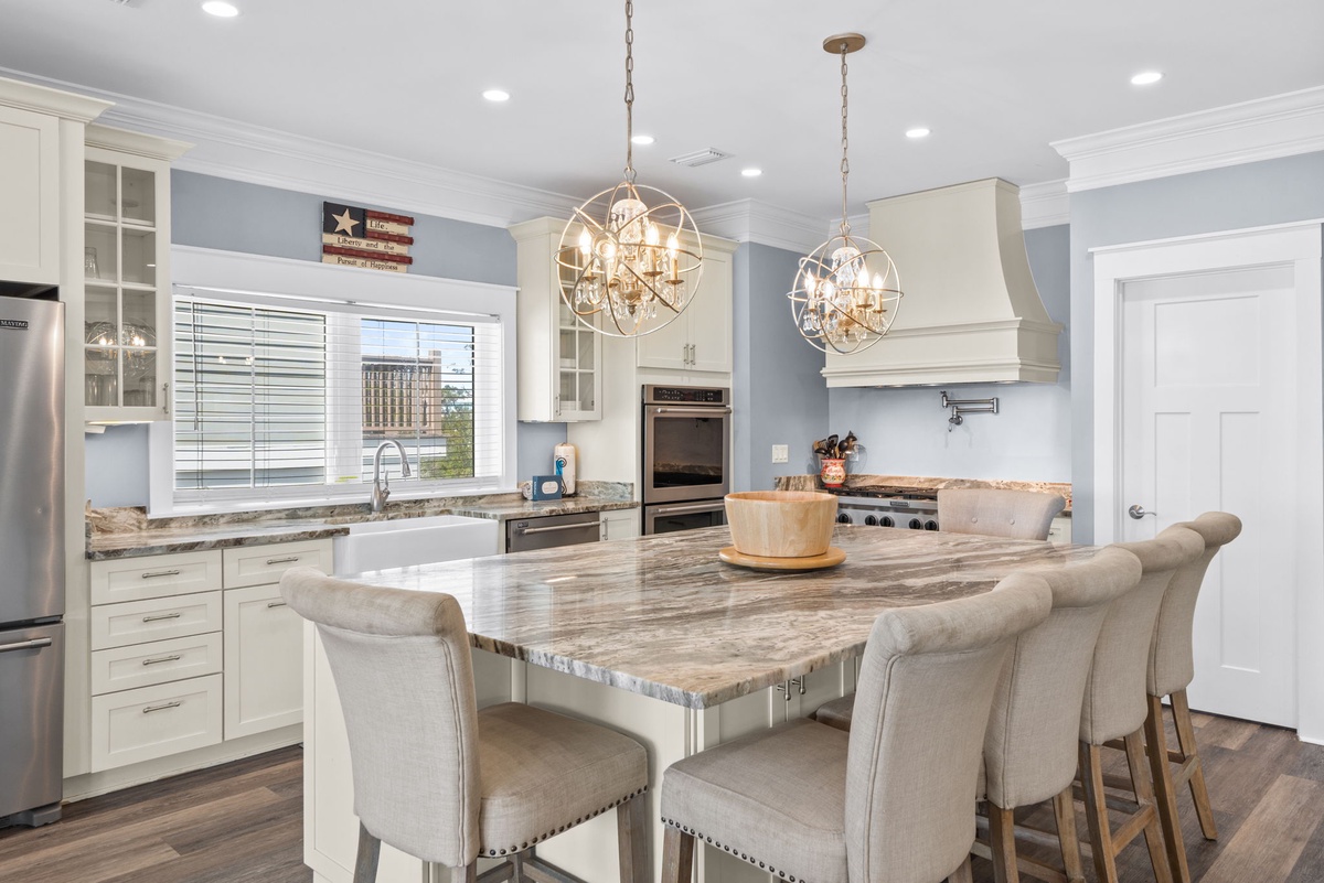 Your dream kitchen awaits with gleaming granite counters, professional-grade appliances, and elegant pendant lighting perfect for morning coffee or dinner prep.