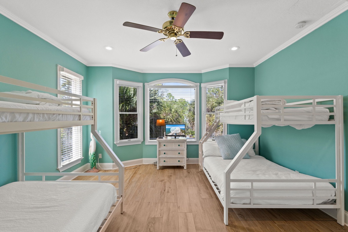 Your kids will love this cheerful bunk room with crisp white beds and soothing turquoise walls.