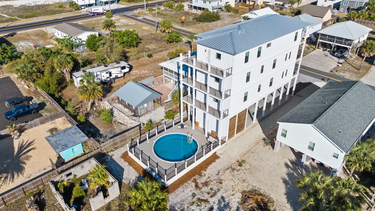 Modern beachside rental features private pool and spacious design in coastal community setting.