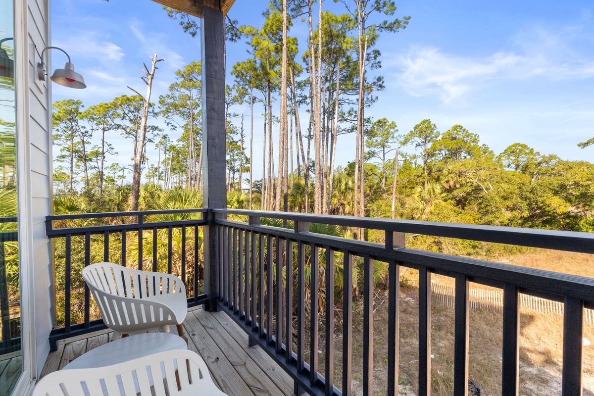 Relax on your private balcony with peaceful forest views, where morning coffee tastes better surrounded by towering pines.