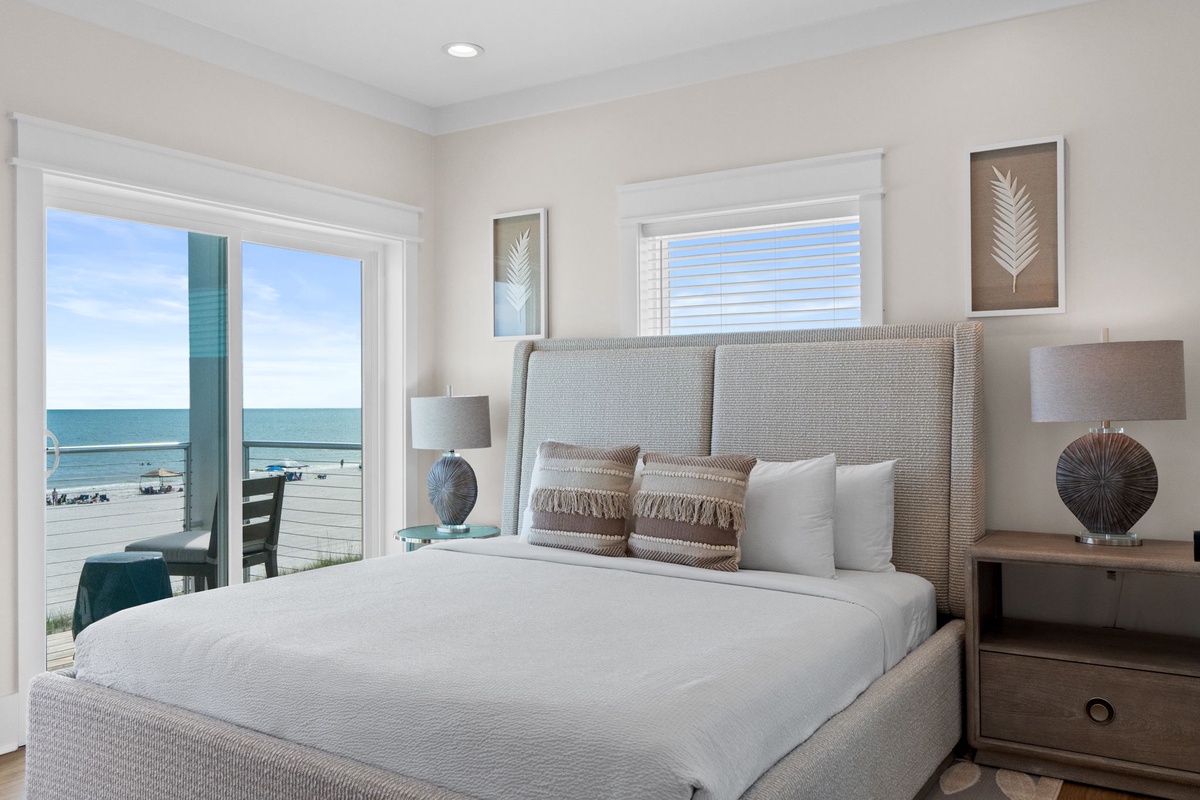 Wake up to stunning ocean views from your coastal bedroom retreat. Step onto your private deck to feel the sea breeze and hear the gentle waves just steps from your door.