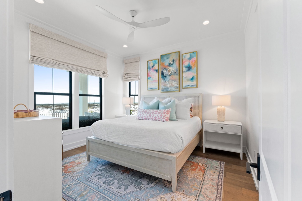 Drift off in your serene bedroom where soft linens meet artistic flair, and morning light streams through windows.