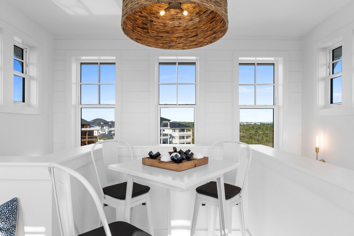 Enjoy intimate meals at your private dining table with stunning natural light streaming through panoramic windows.
