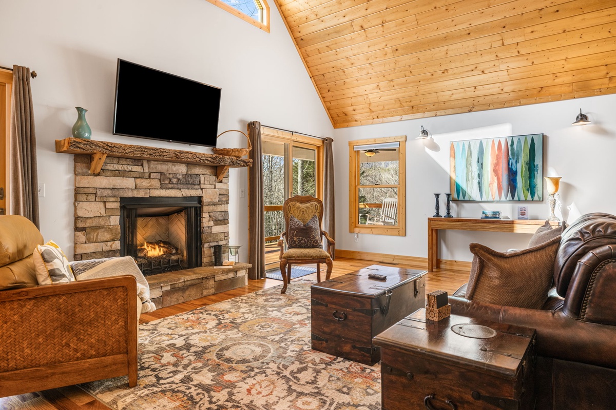 Living Area w/ Gas Fireplace & Vaulted Ceiling