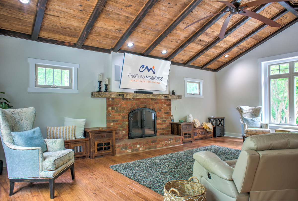 Gather Under the Vaulted Ceilings By the Wood Fireplace