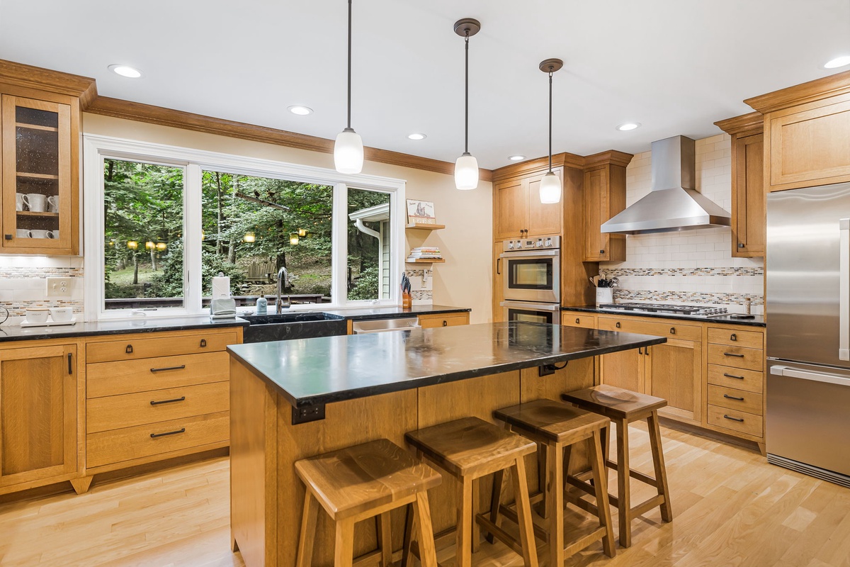 Gourmet Kitchen w/ Two Ovens, Soapstone Countertops & Wooded Views