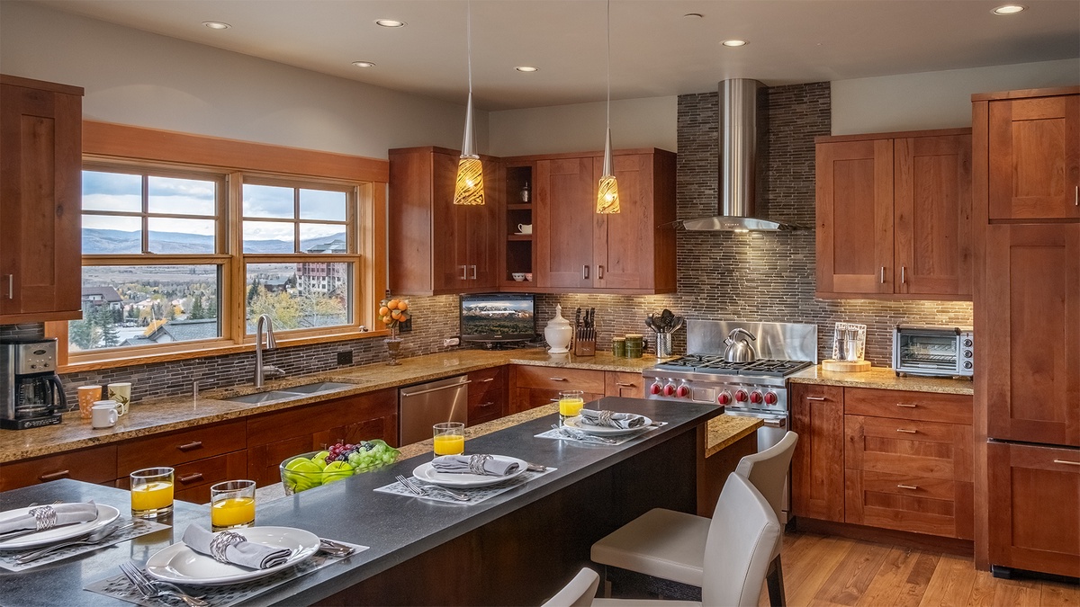 Kitchen, Main Level, Sunshine Peak Chalet - Island with bar seating and pendant lighting