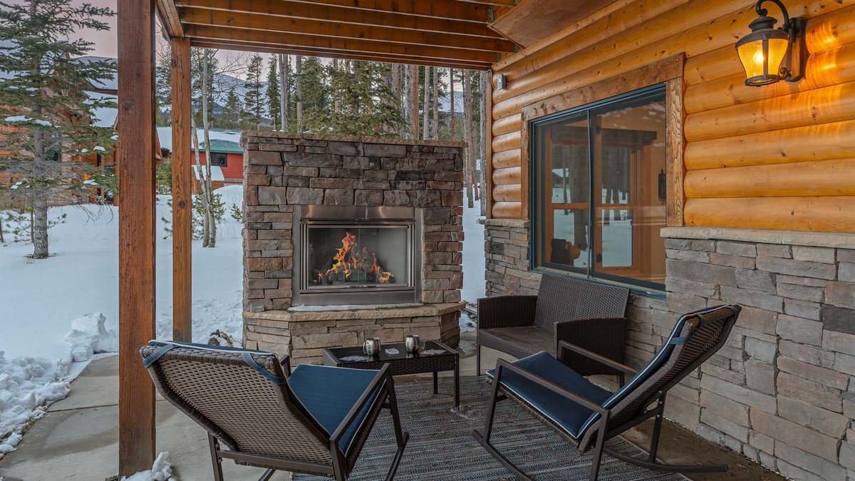 Warm up by the outdoor fireplace on the lower level patio