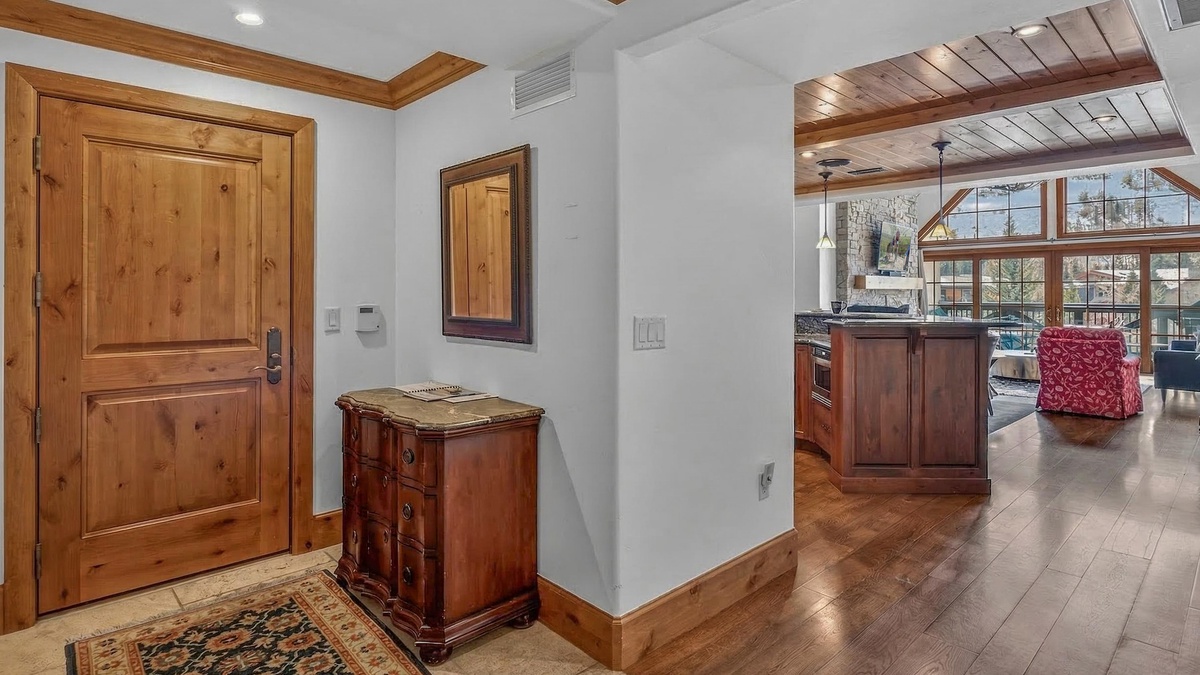 Entry Area, Main Level - Hallway with console table and wall mirror