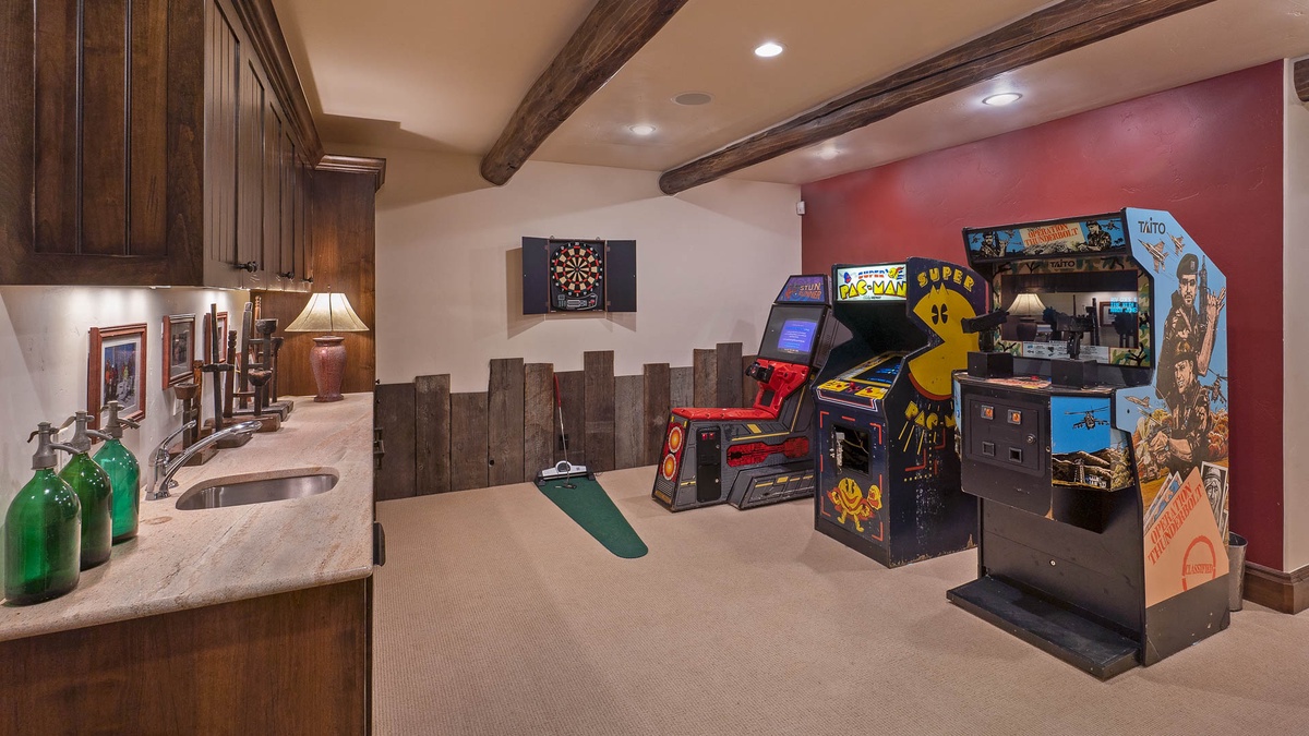 Game room on lower level features vintage arcade games