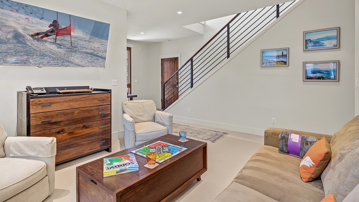 Family Room, Lower Level - TV with queen sleeper sofa and seating area