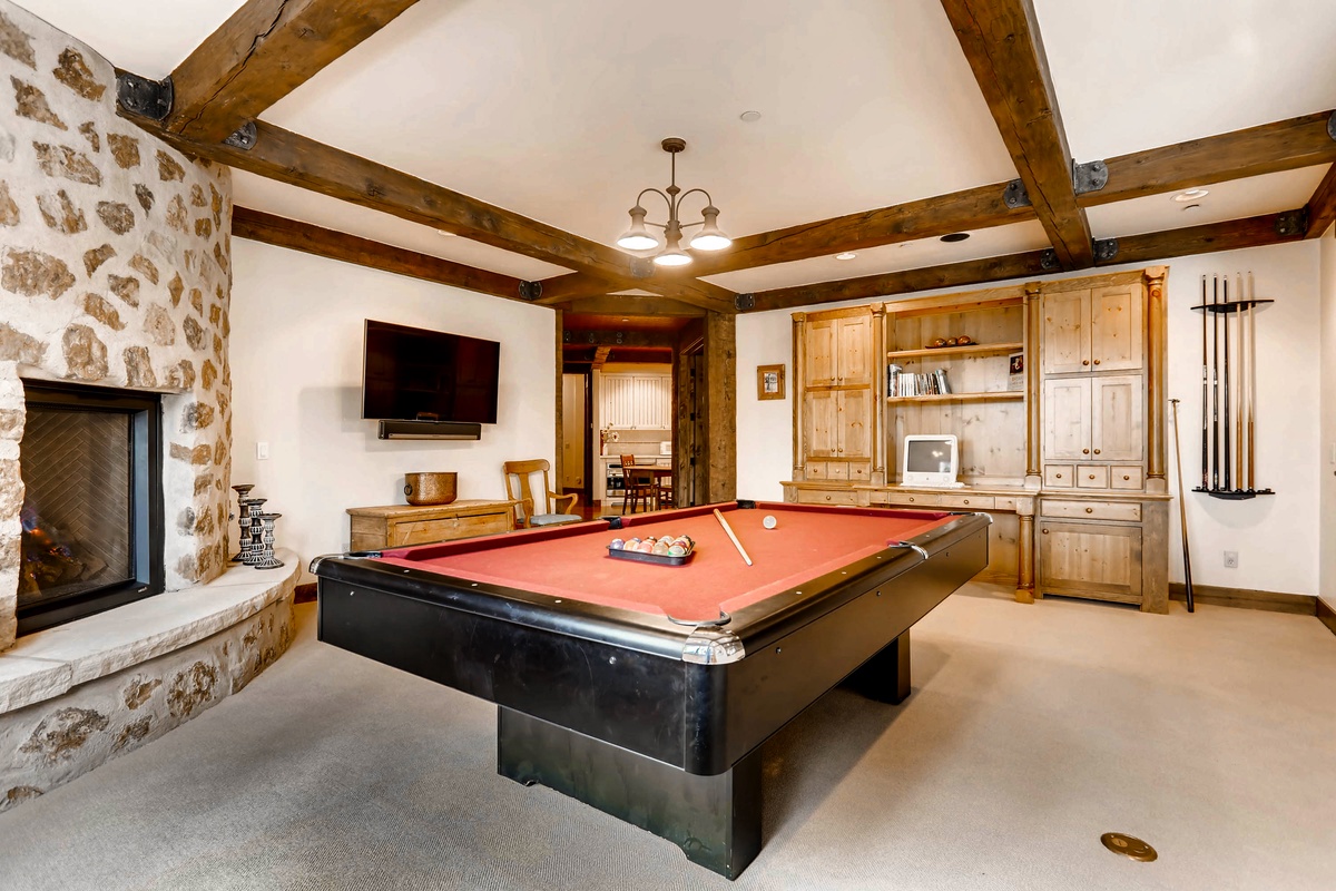 Billiards, TV and fireplace on lower level