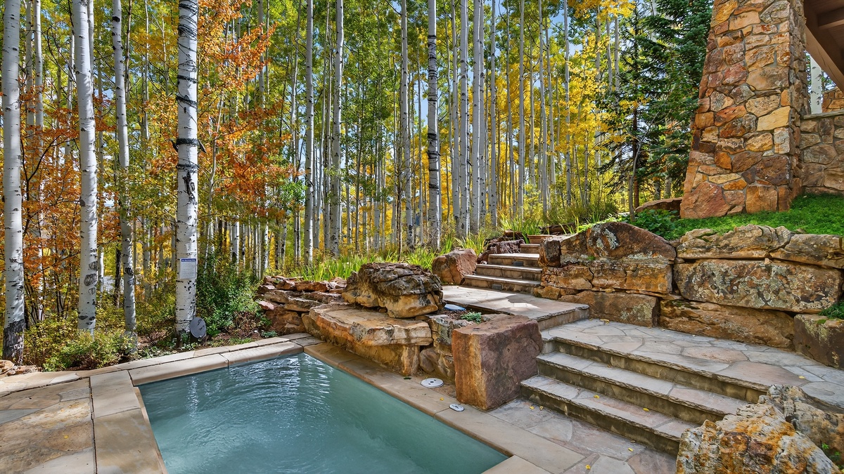 In ground hot tub with fall colors
