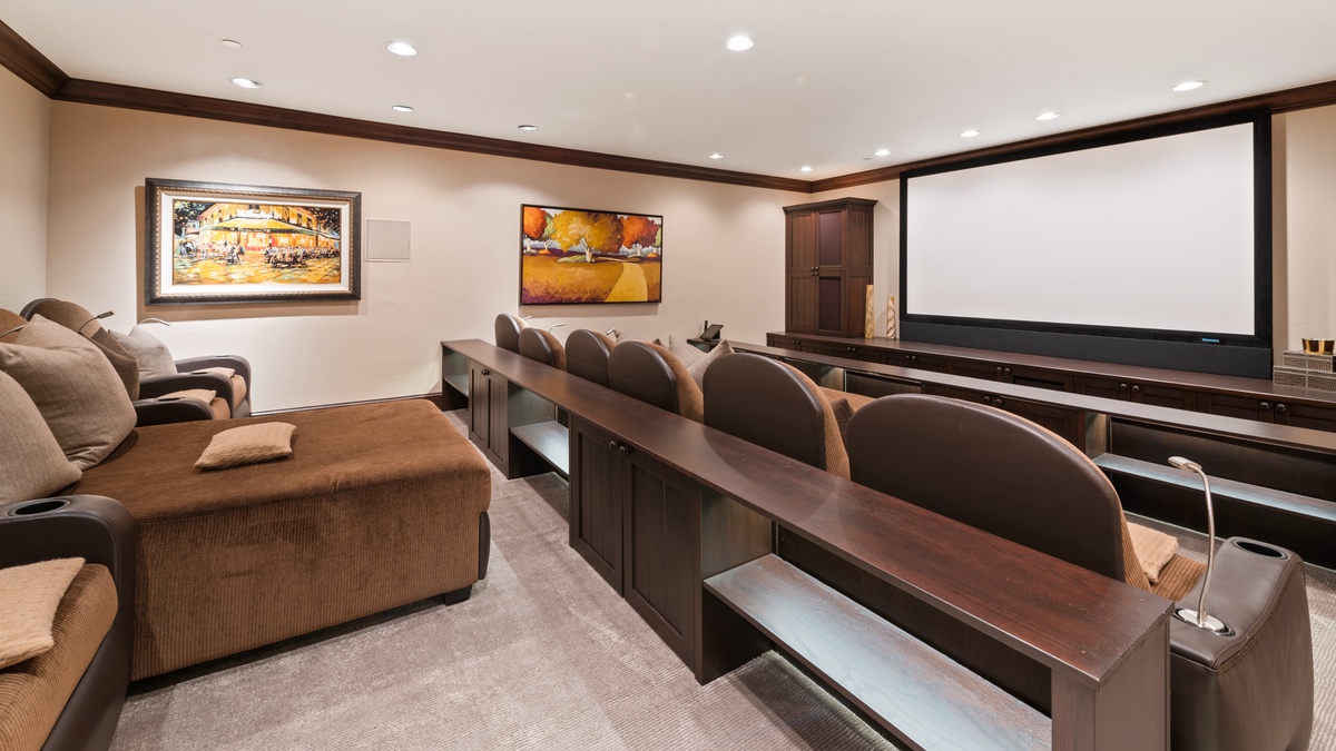 A state-of-the-art theatre room with plush seating for 12