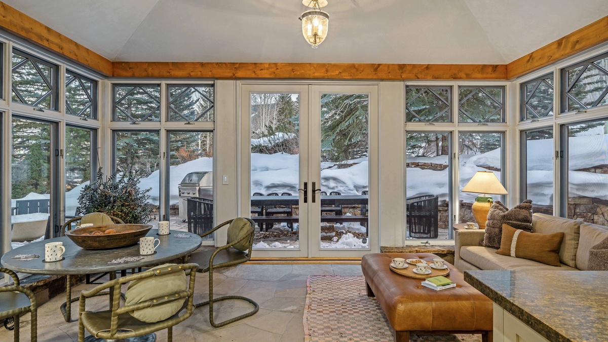 Elegant and cozy sunroom adjacent to kitchen