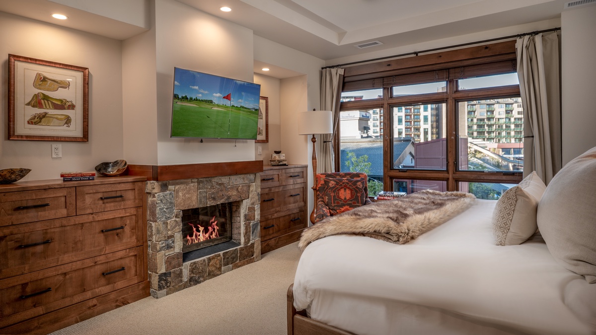Bedroom 1, Main Level - Primary king bedroom with fireplace and TV