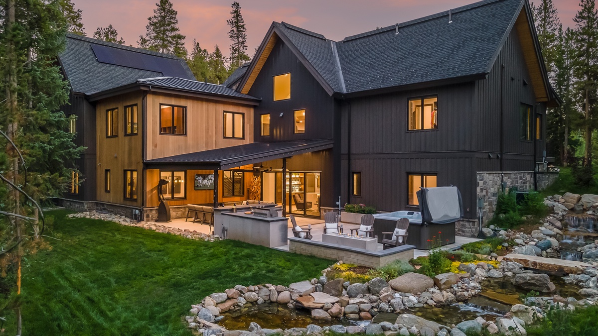Aerial of the covered back patio, hot tub, and outdoor bar & grill