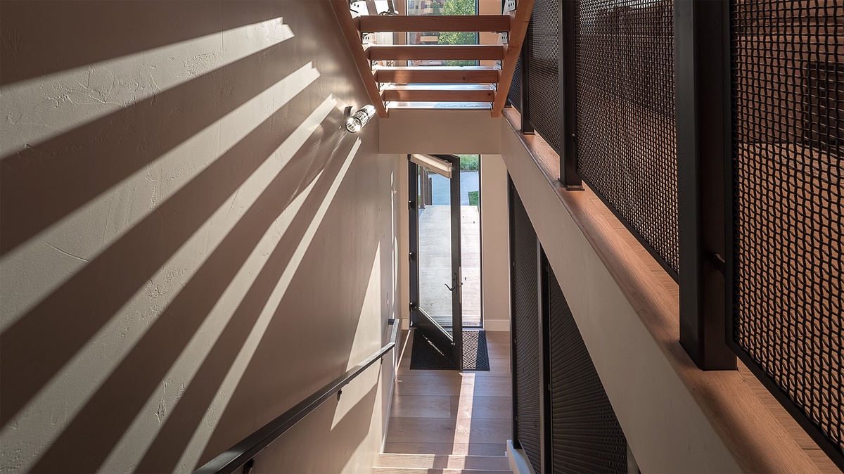 View down the stairway to the street-level entry