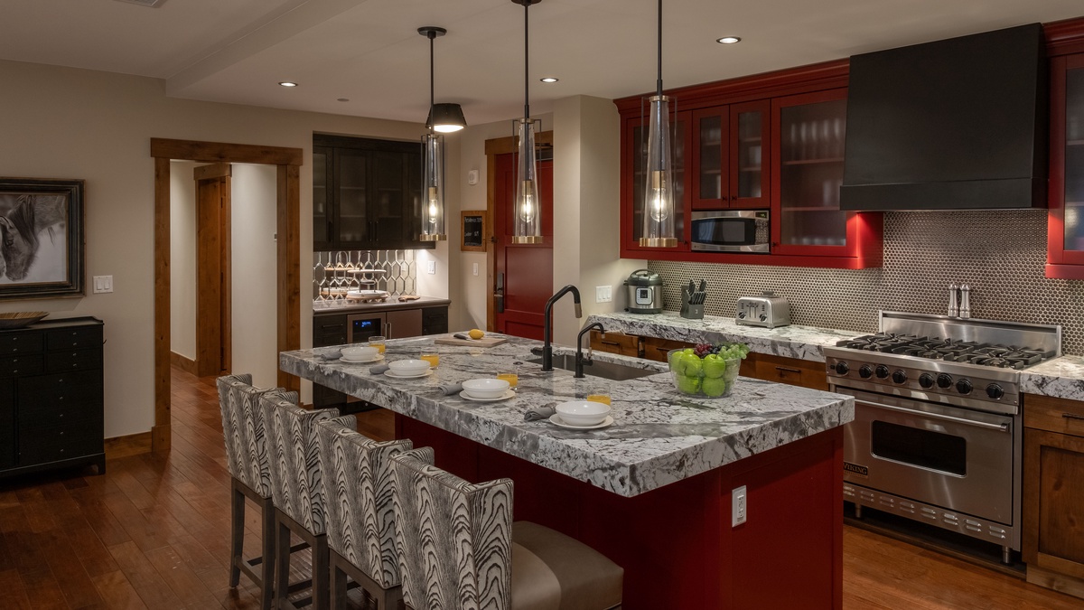 Kitchen, Main Level - With large island and red cabinetry