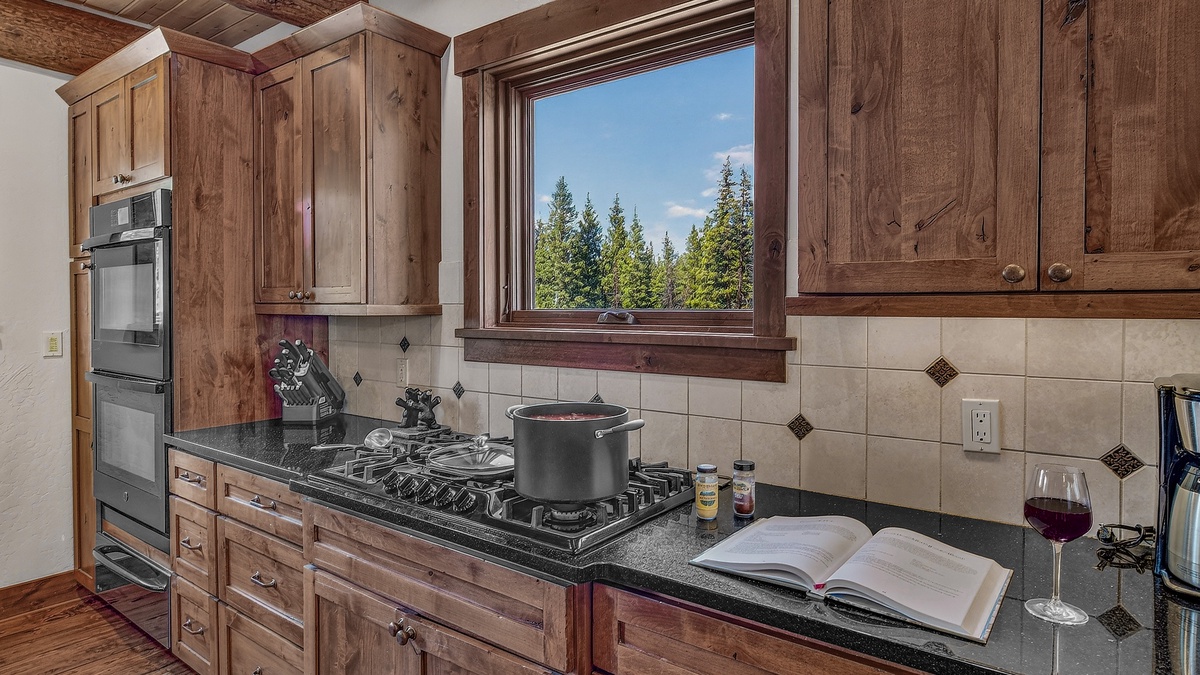 Kitchen, Main Level - Gas cooktop with forest views