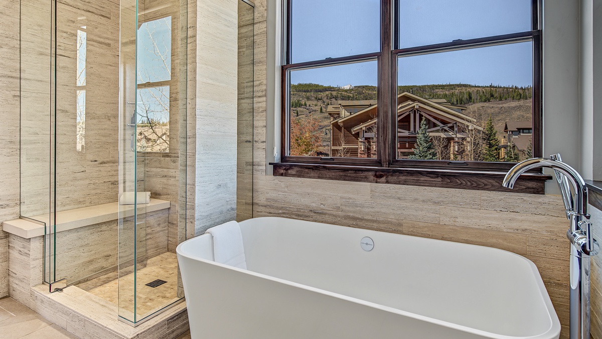 Bedroom 1, Main Level - Primary ensuite with soaking tub and walk-in shower