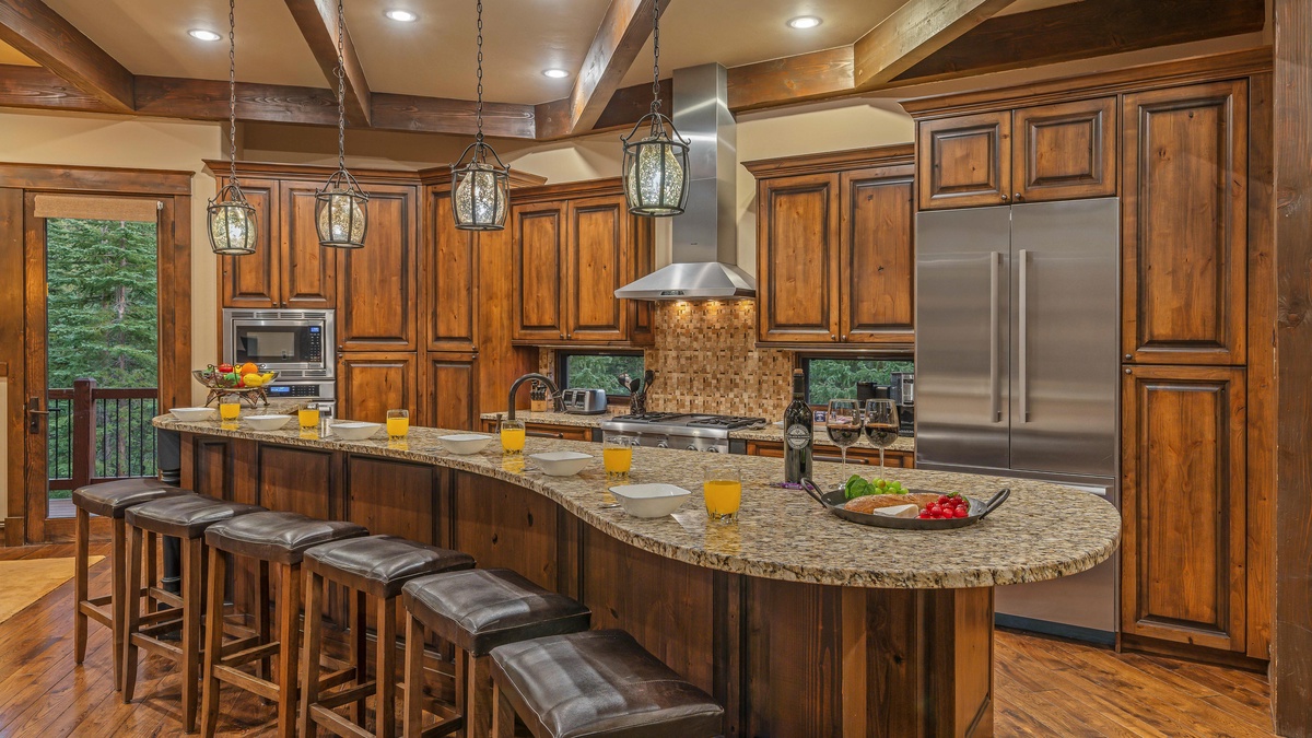 Main level gourmet kitchen with breakfast bar