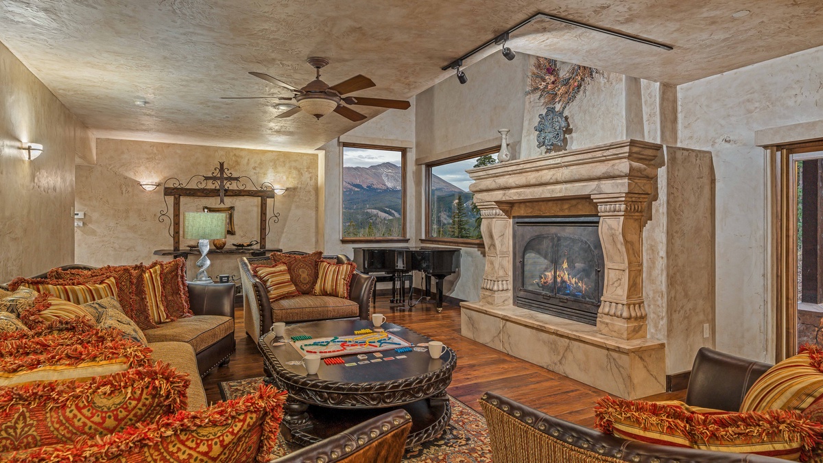 Great room on main level with fireplace and ski slope views