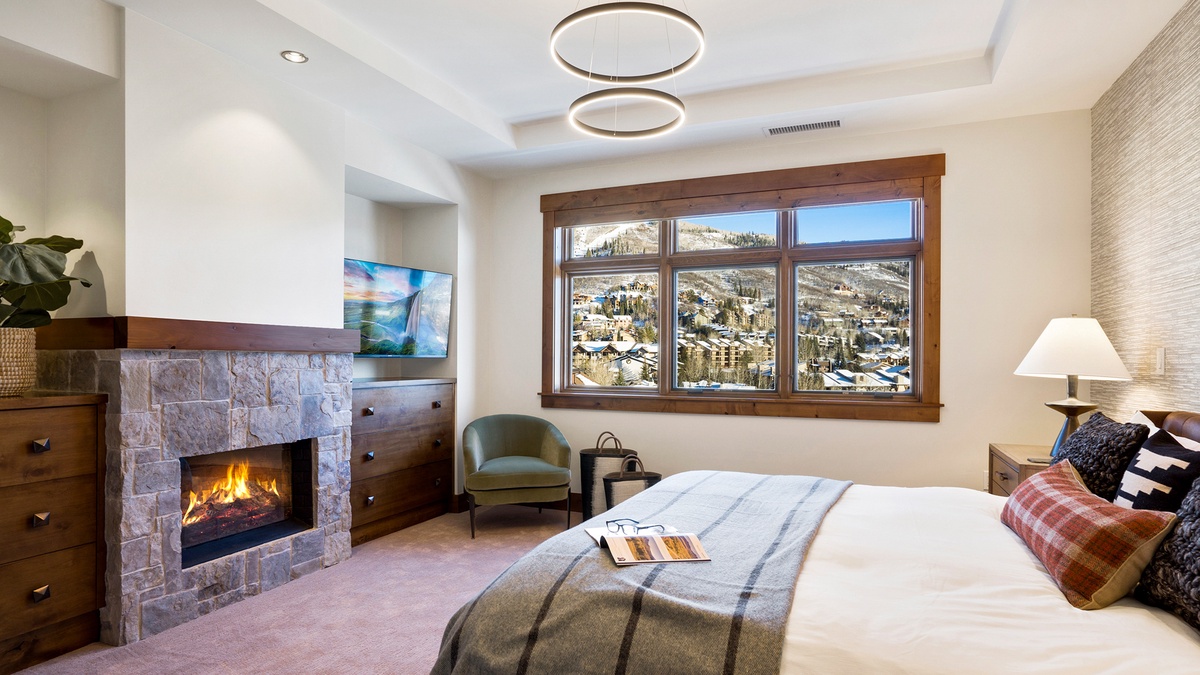 Bedroom 1, Main Level - Primary king suite with fireplace and TV