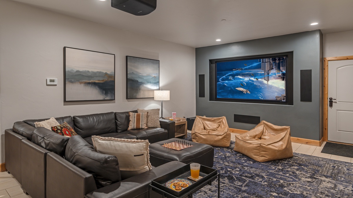 Large projection TV and comfortable sectional on lower level