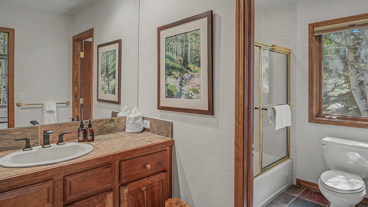 Bedroom 2, Upper Level - Ensuite with single vanity and shower tub combo
