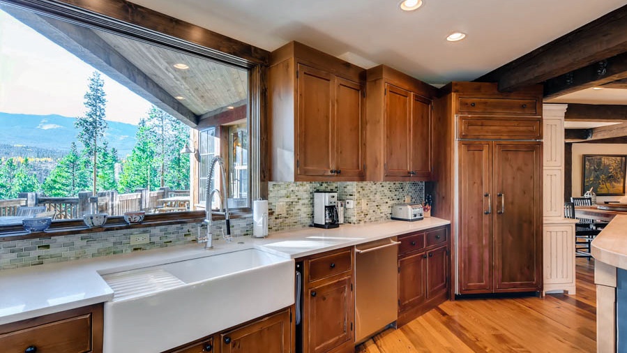 Kitchen with farm sink and views