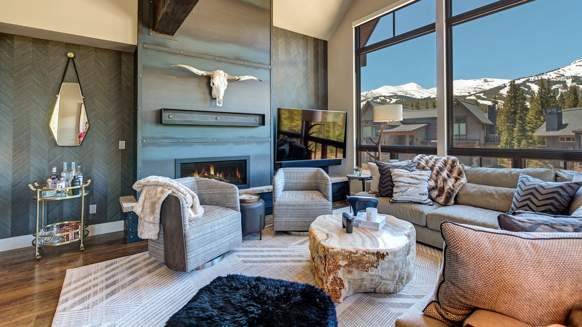 Great Room, Main Level - With gas fireplace, large flat-screen TV, and views