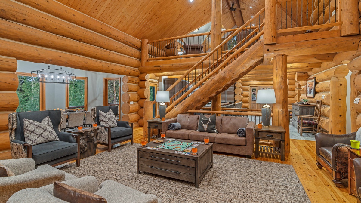 Great room with an open staircase and loft up above