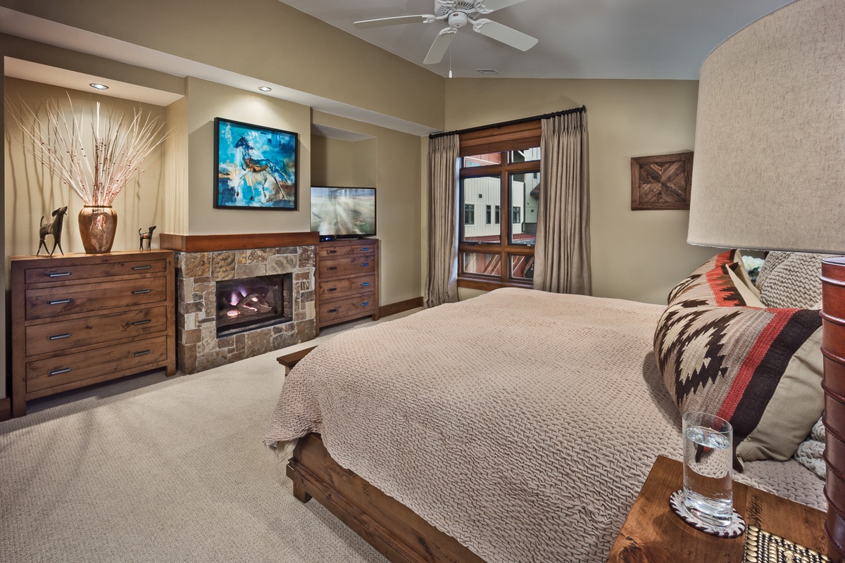 Bedroom 1, Main Level - Primary king suite with fireplace and TV
