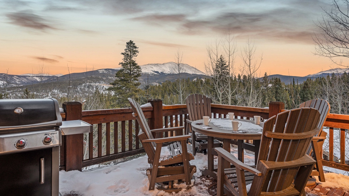 Main level deck off the kitchen with grill, seating and views