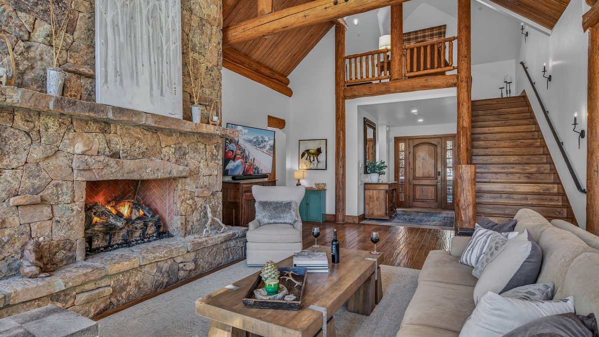 Great Room, Main Level - Open-concept living area with fireplace and vaulted ceilings