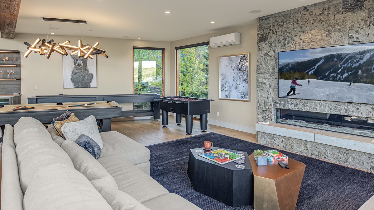 Family Room, Upper Level - Seating area with fireplace and TV