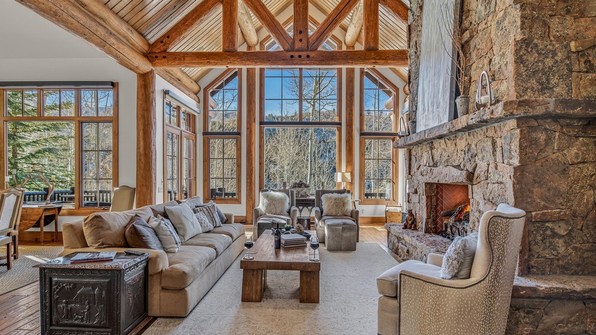 Great Room, Main Level - Vaulted ceilings with floor-to-ceiling windows and mountain views