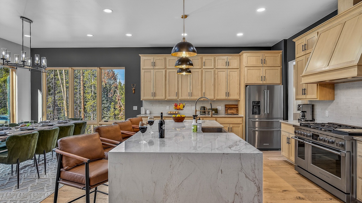 Kitchen, Main Level - Large island with bar seating and modern appliances