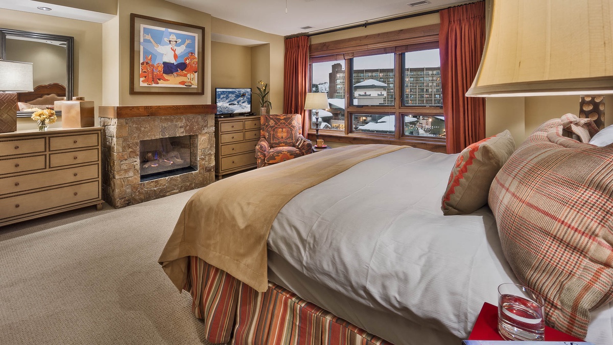 Bedroom 1, Main Level - Primary king suite with fireplace and TV