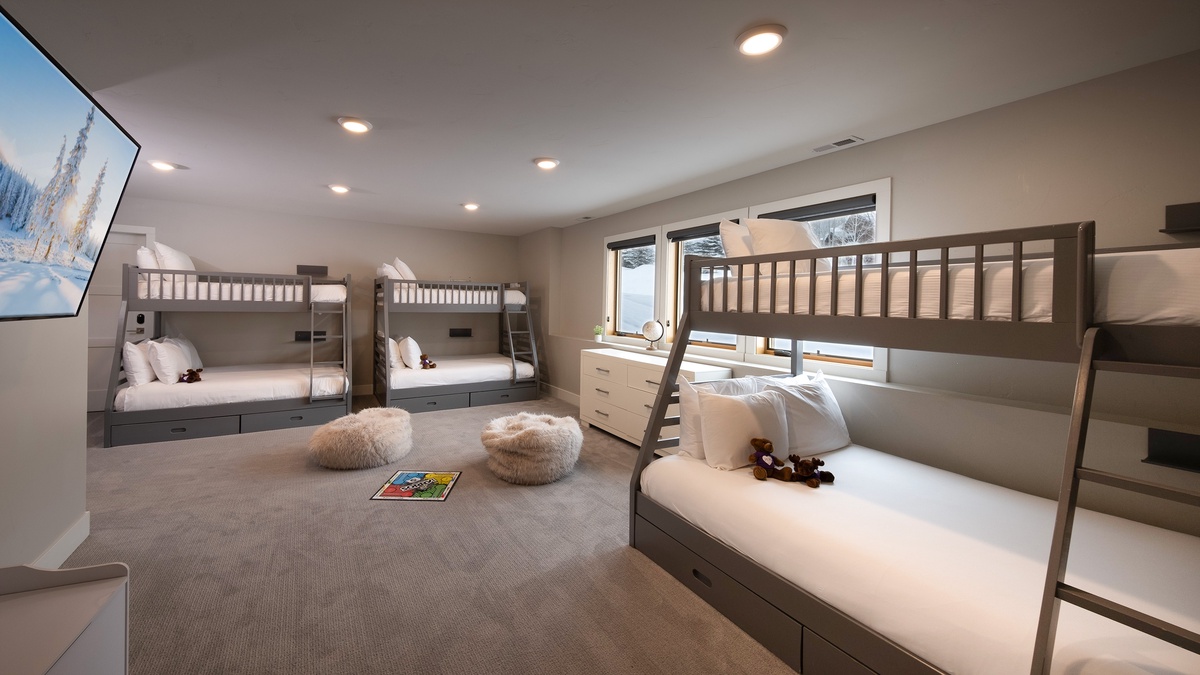 Bedroom 4, Lower Level - Spacious bunkroom with three twin-over-full bunk beds and large TV