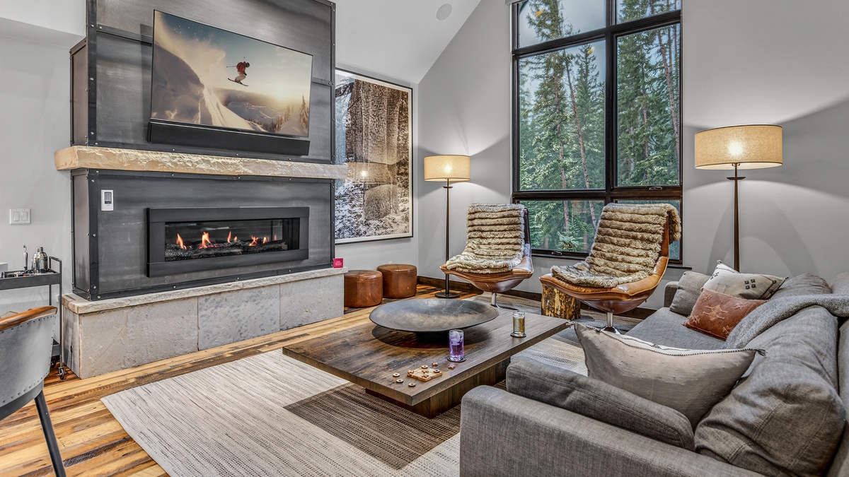 Great Room, Main Level - Seating area with fireplace and large windows