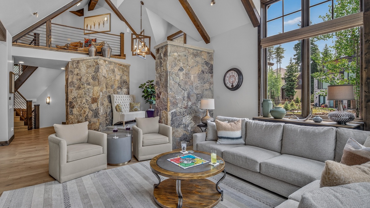 Great Room, Main Level - Comfortable seating area with stone accents and natural light