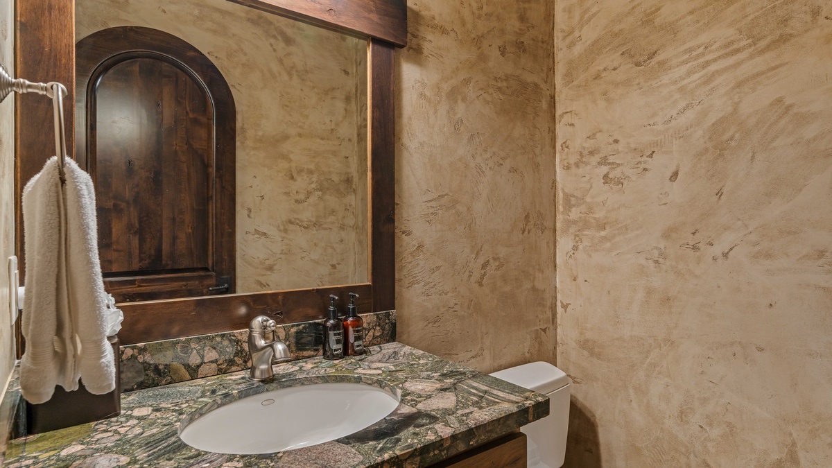 Powder bath on main level, adjacent to ski storage room