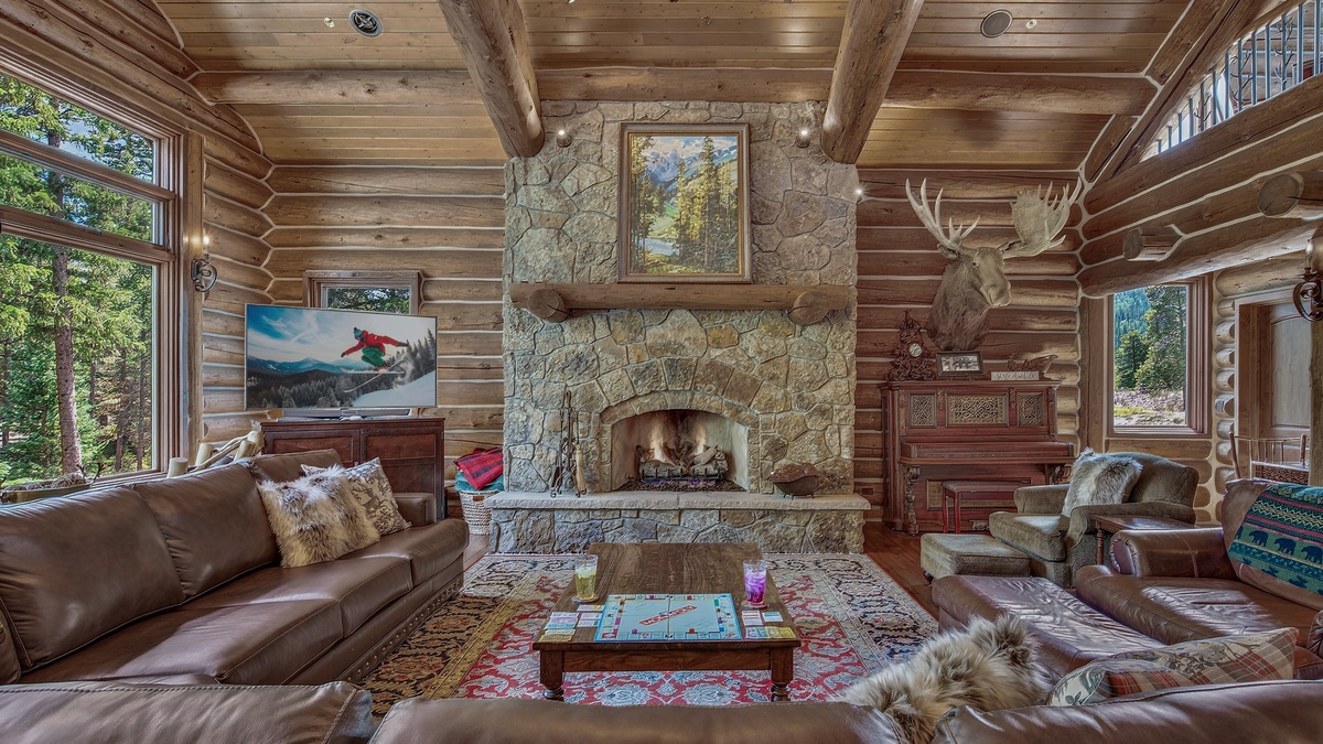Great Room, Main Level - Stone fireplace with TV and seating area