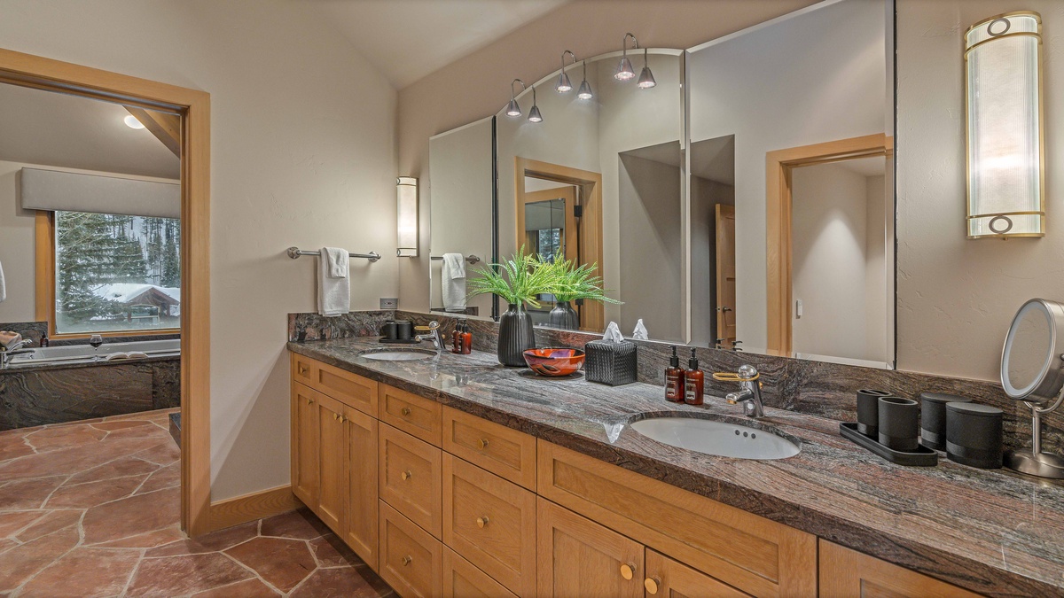 Bedroom 1, Upper Level - Primary king ensuite with dual vanities, spa tub, and walk-in closet
