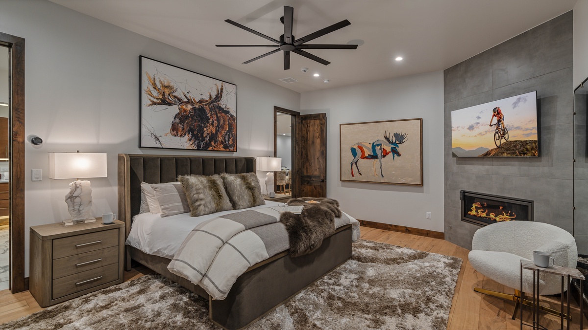 Bedroom 1, Main Level - Primary king suite on main level with TV and fireplace