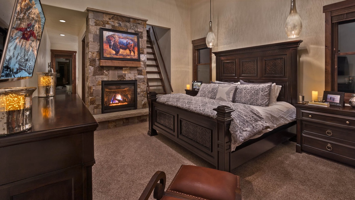 Bedroom 1, Upper Level - Primary king bed with fireplace and loft access